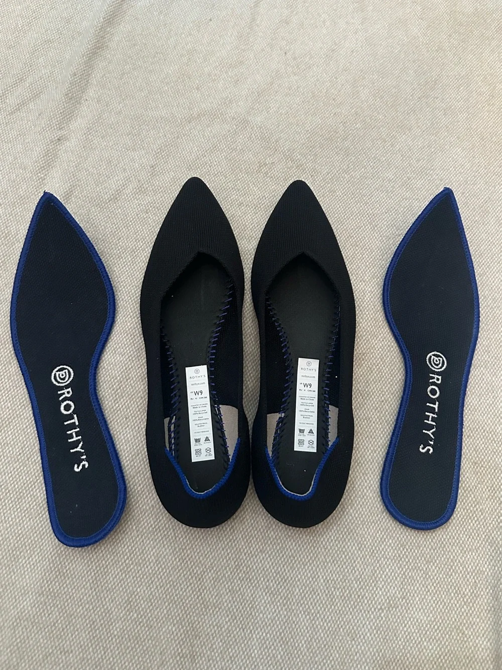 Rothy's Black Pointed Knit Flats with Blue Heel Trim